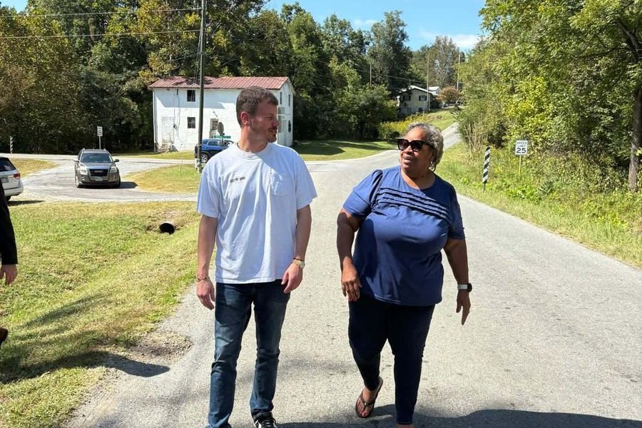 Mayor Holland Perdue and resident Sandra Poindexter Smith walk up Diamond Avenue.